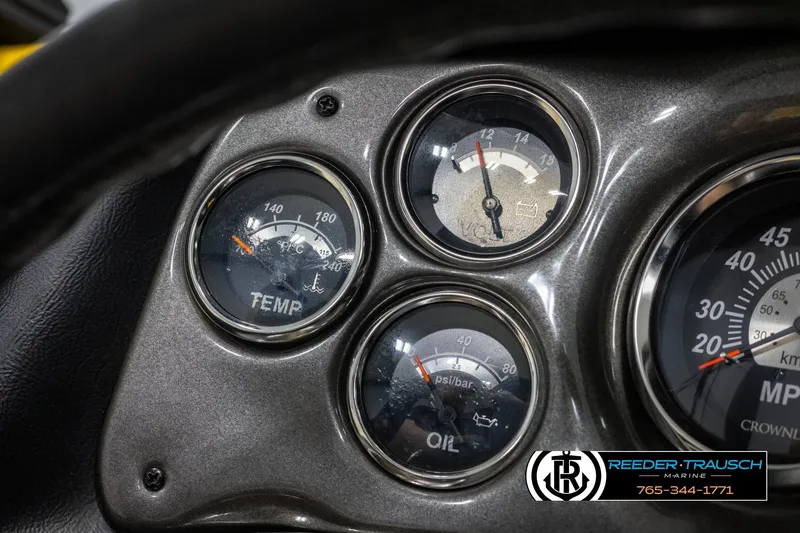 Slide: The Image of Dashboard gauges of a 2007 Crownline 21 SS boat, showing temperature, oil, and speed indicators. - 31