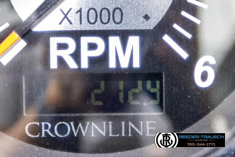 Slide: The Image of Close-up of a 2007 Crownline 21 SS RPM gauge displaying 2124 RPM. - 32