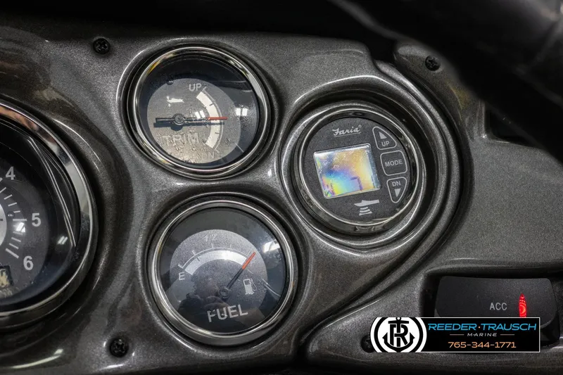 Slide: The Image of Dashboard of a 2007 Crownline 21 SS boat with fuel and trim gauges. - 33