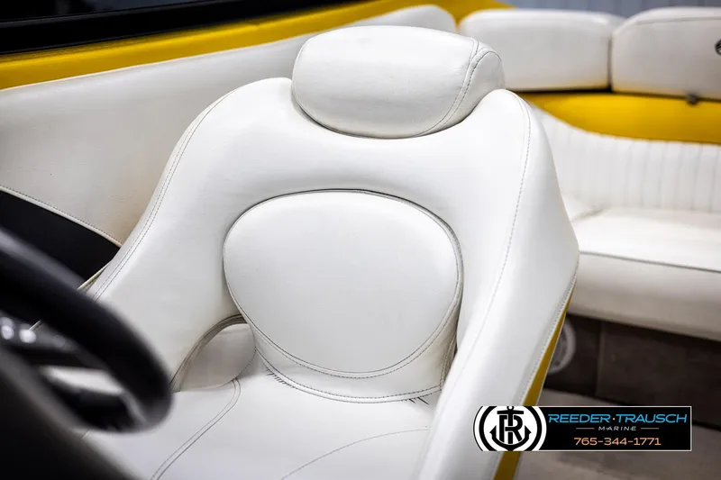 Slide: The Image of White leather seat in 2007 Crownline 21 SS boat interior, featuring yellow accents. - 36