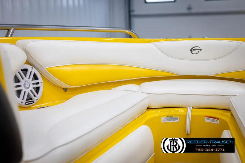 Slide: The Image of Interior of a 2007 Crownline 21 SS boat with yellow and white seating. - 37