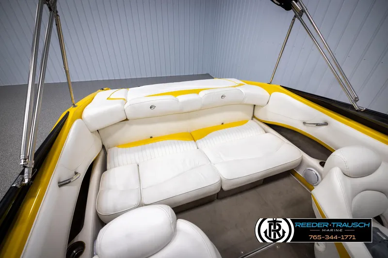 Slide: The Image of 2007 Crownline 21 SS boat interior with white and yellow seating, Reeder-Trausch Marine branding. - 42