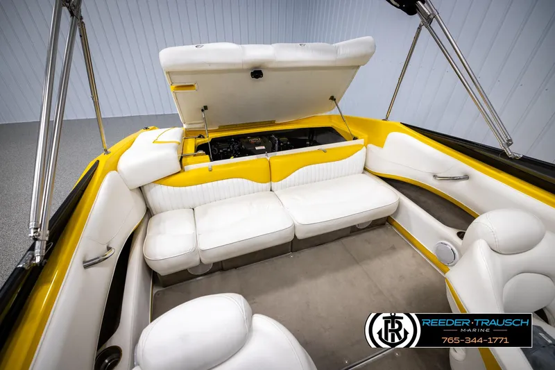 Slide: The Image of 2007 Crownline 21 SS boat interior with white seating and yellow accents. - 43