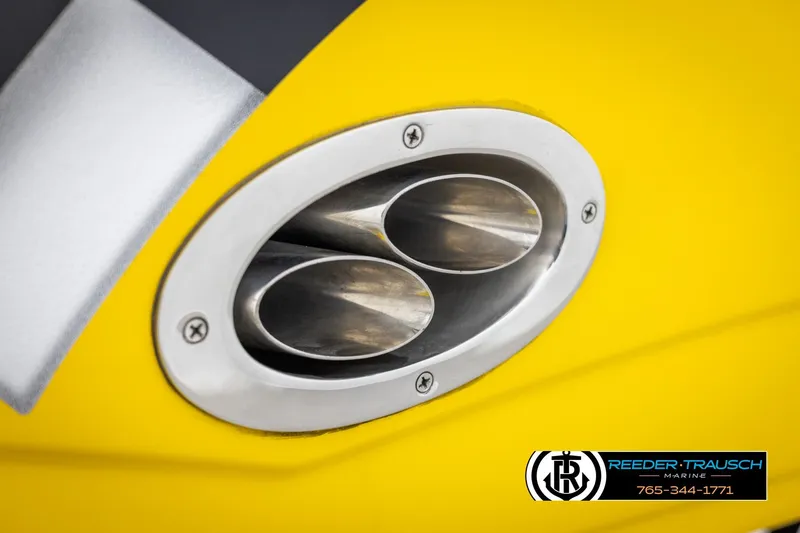 Slide: The Image of Close-up of a 2007 Crownline 21 SS boat exhaust on a yellow hull. - 50