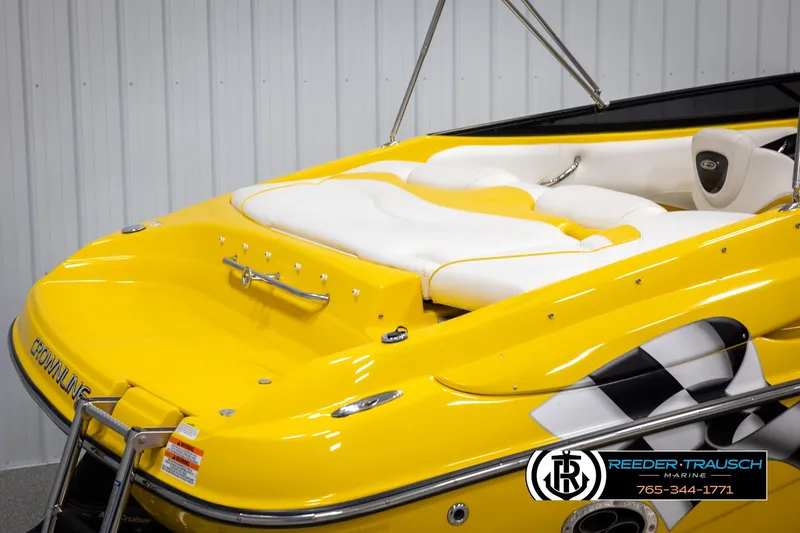 Slide: The Image of Yellow 2007 Crownline 21 SS boat with white seating and checkered flag design. - 52