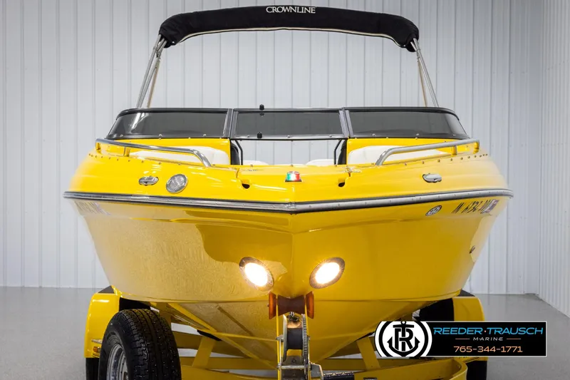 Slide: The Image of 2007 Crownline 21 SS boat, vibrant yellow, front view, displayed indoors. - 8