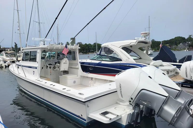 Slide: The Image of 2023 Steiger Craft 31 Fisherman boat docked with twin Mercury engines. - 0