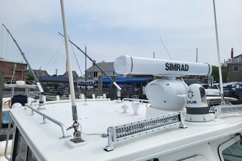 Slide: The Image of 2023 Steiger Craft 31 Fisherman with Simrad and FLIR equipment at a marina. - 17