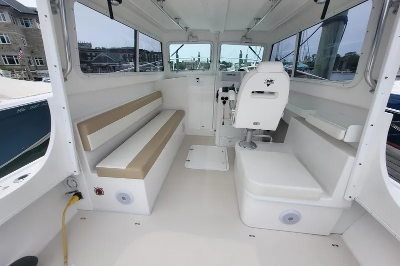 Slide: The Image of Interior of 2023 Steiger Craft 31 Fisherman boat with seating and helm. - 2