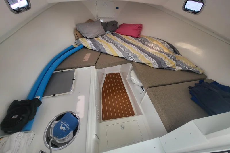Slide: The Image of 2023 Steiger Craft 31 Fisherman cabin interior with cozy bedding and seating. - 25