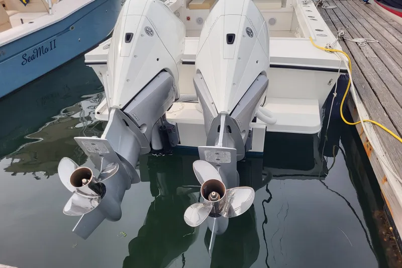 Slide: The Image of 2023 Steiger Craft 31 Fisherman with dual outboard motors docked at marina. - 27