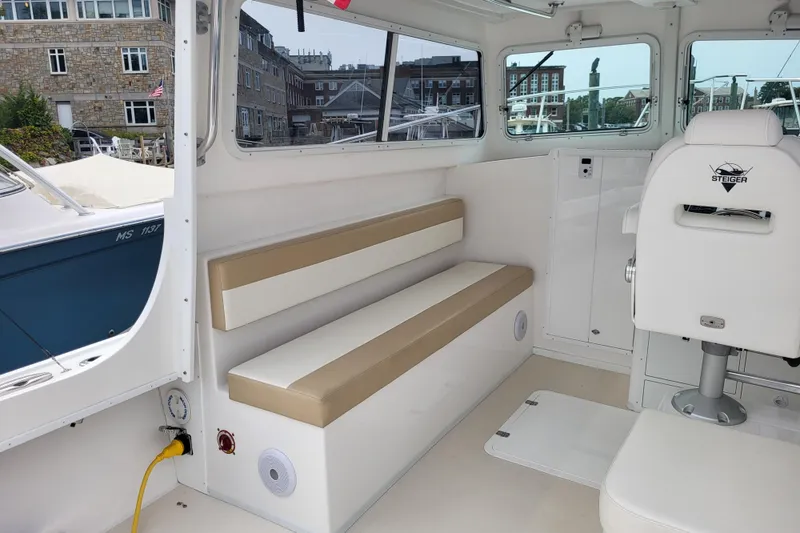 Slide: The Image of Interior of 2023 Steiger Craft 31 Fisherman boat with seating and helm chair. - 4