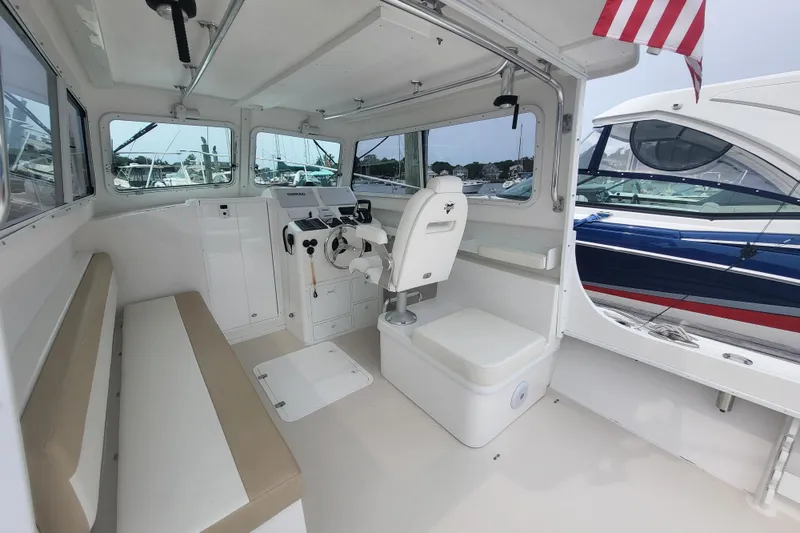 Slide: The Image of Interior of 2023 Steiger Craft 31 Fisherman boat with seating and helm station. - 5