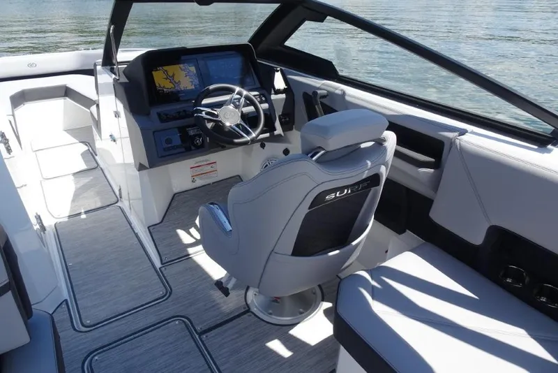 Slide: The Image of 2026 Cobalt R8 Surf boat interior with modern dashboard and steering wheel. - 12