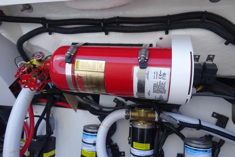 Slide: The Image of Engine compartment of 2026 Cobalt R8 Surf with fire extinguisher and wiring. - 27