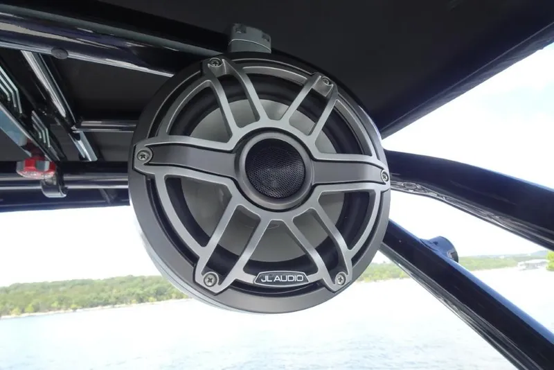 Slide: The Image of Speaker on 2026 Cobalt R8 Surf boat, featuring JL Audio, with lake view. - 29