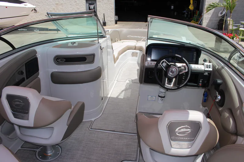 Slide: The Image of 2023 Crownline 290 SS boat interior with modern dashboard and seating. - 5