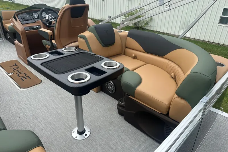 Slide: The Image of Luxurious interior of 2025 Tahoe 2185 boat with plush seating and cup holders. - 11