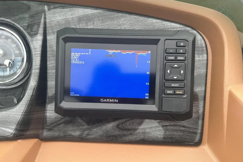 Slide: The Image of Garmin display on 2025 Tahoe 2185 dashboard, showing navigation and speedometer. - 16