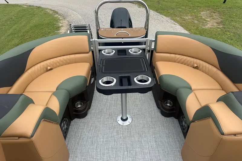 Slide: The Image of Luxurious 2025 Tahoe 2185 boat interior with plush seating and cup holders. - 21