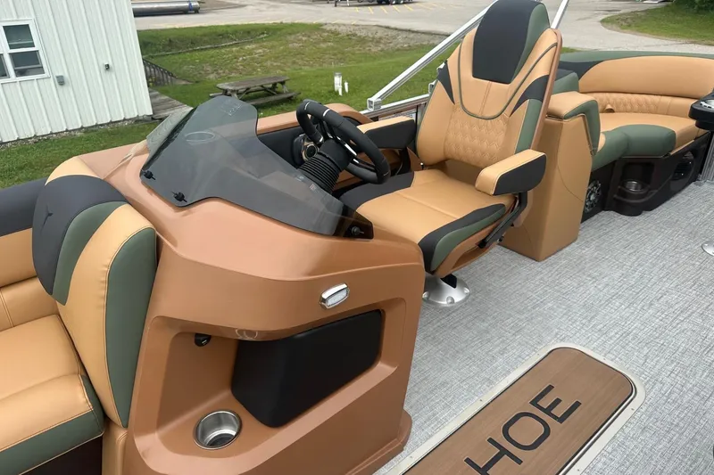 Slide: The Image of Luxurious 2025 Tahoe 2185 boat interior with plush seating and modern helm design. - 23