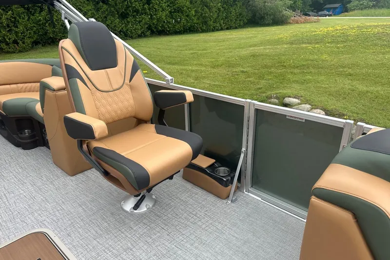Slide: The Image of Luxurious seating on 2025 Tahoe 2185 boat, featuring tan and black upholstery. - 25
