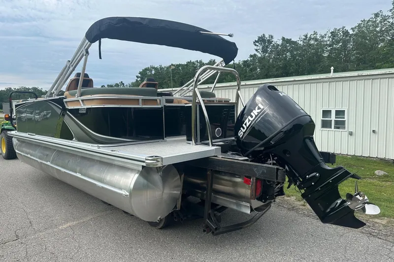 Slide: The Image of 2025 Tahoe 2185 pontoon boat with Suzuki outboard motor on trailer. - 4
