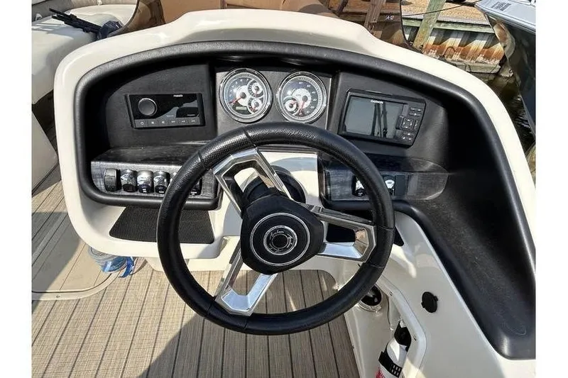 Slide: The Image of Steering console of 2021 Avalon 2785 boat with gauges and controls. - 4