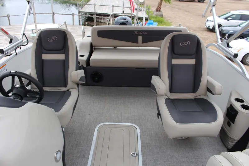 Slide: The Image of 2022 Barletta C22UC pontoon boat interior with plush seating and modern design. - 3