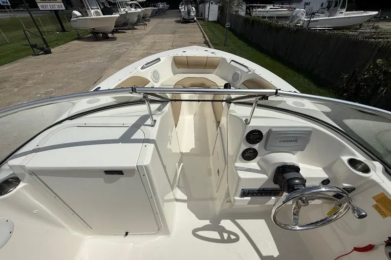 Slide: The Image of 2019 Key West 203 DFS boat interior with steering wheel and Garmin navigation system. - 14