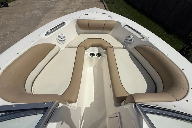 Slide: The Image of 2019 Key West 203 DFS boat interior with beige seating and cup holders. - 15