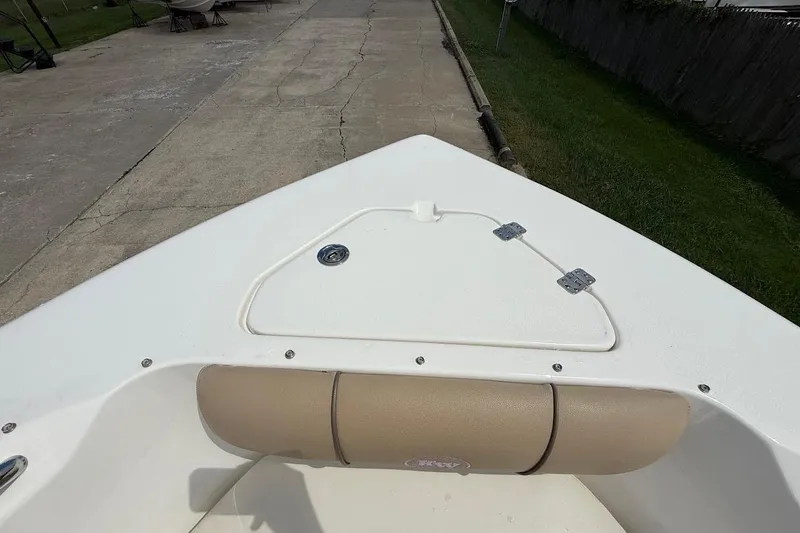 Slide: The Image of 2019 Key West 203 DFS boat bow with storage compartment and cushioned seating. - 17