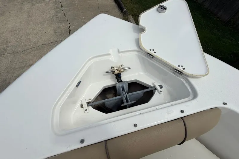 Slide: The Image of Open anchor compartment on 2019 Key West 203 DFS boat, showing anchor storage. - 18