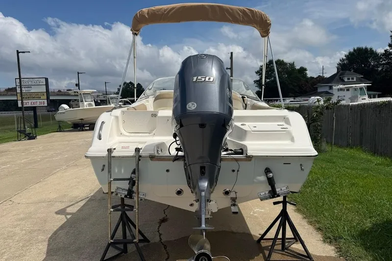 Slide: The Image of 2019 Key West 203 DFS boat with Yamaha 150 engine on display outdoors. - 3
