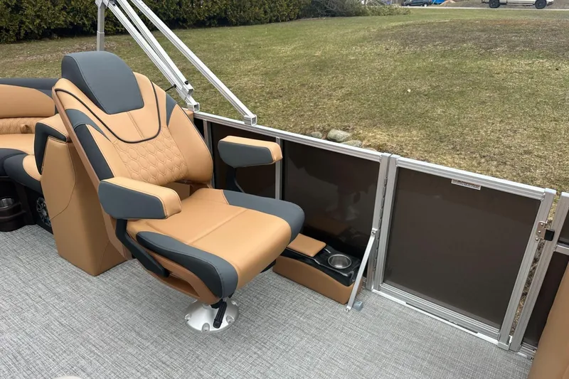 Slide: The Image of Luxurious seating on 2025 Tahoe 2185 boat, featuring tan and gray upholstery. - 15