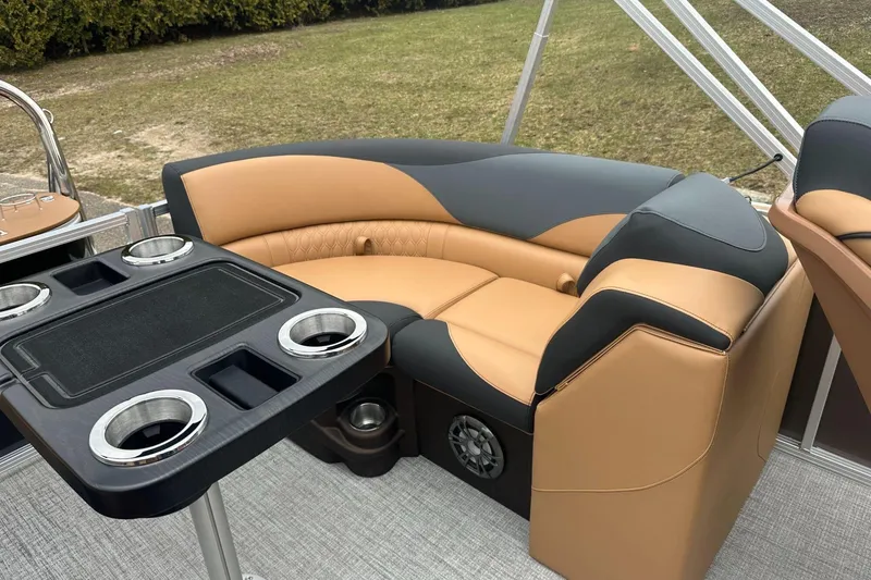 Slide: The Image of Luxurious seating area on 2025 Tahoe 2185 boat with cup holders and modern design. - 16