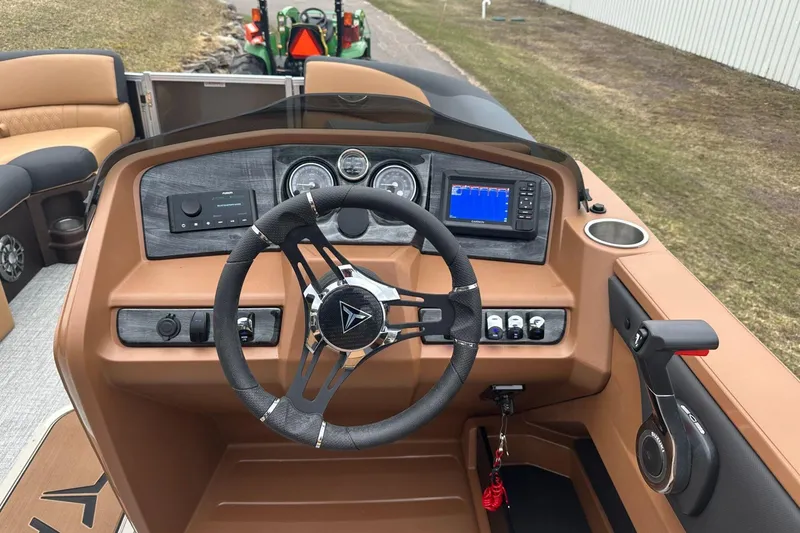Slide: The Image of Steering console of 2025 Tahoe 2185 boat with modern controls and dashboard. - 19