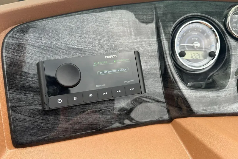 Slide: The Image of Dashboard of 2025 Tahoe 2185 with Fusion Bluetooth audio system and RPM gauge. - 20