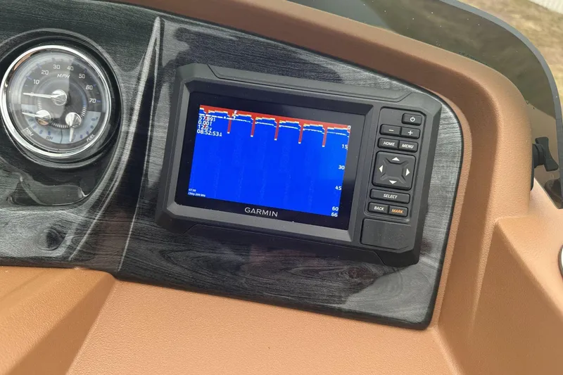 Slide: The Image of Dashboard of a 2025 Tahoe 2185 with Garmin navigation system and speedometer. - 21