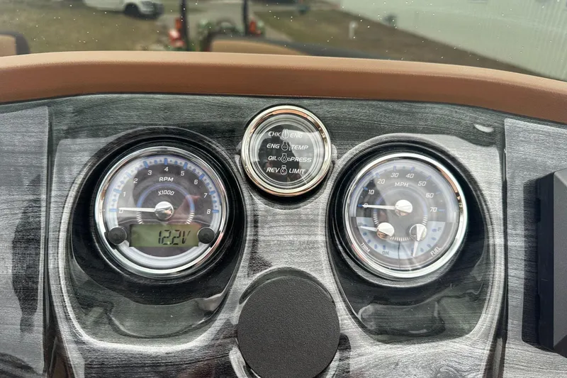 Slide: The Image of Dashboard of 2025 Tahoe 2185 with RPM and speed gauges. - 22