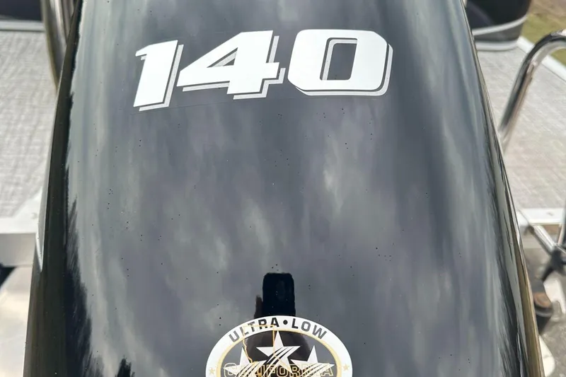 Slide: The Image of Close-up of a 2025 Tahoe 2185 outboard motor with '140' and 'Ultra Low' emblem. - 5