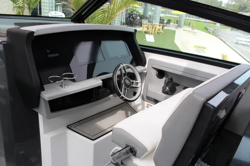 Slide: The Image of Interior cockpit of 2022 Cobalt A36 boat with modern steering and controls. - 2