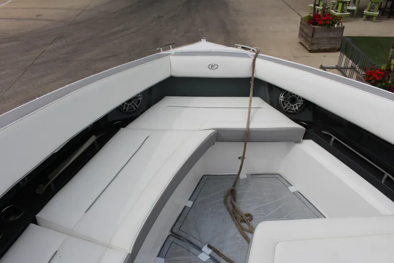 Slide: The Image of Bow seating area of 2022 Cobalt A36 boat with white cushions and speakers. - 3