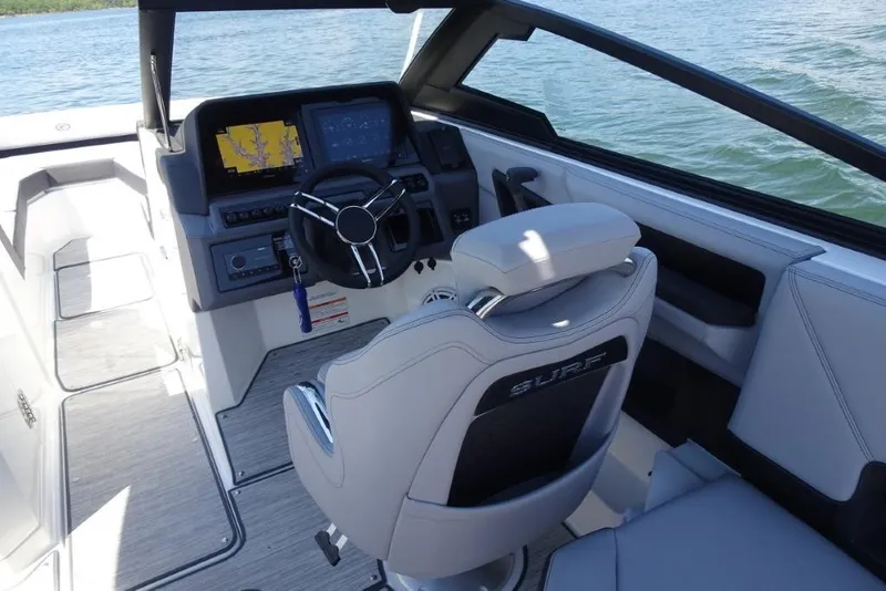 Slide: The Image of Interior of 2026 Cobalt R8 Surf boat with modern dashboard and steering wheel. - 11
