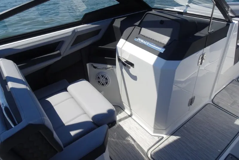 Slide: The Image of 2026 Cobalt R8 Surf boat interior with sleek seating and modern dashboard design. - 16