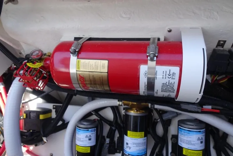 Slide: The Image of Engine compartment of 2026 Cobalt R8 Surf with fire extinguisher and wiring. - 24