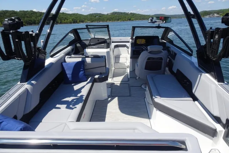 Slide: The Image of 2026 Cobalt R8 Surf boat interior with seating, blue cushions, and lake view. - 7