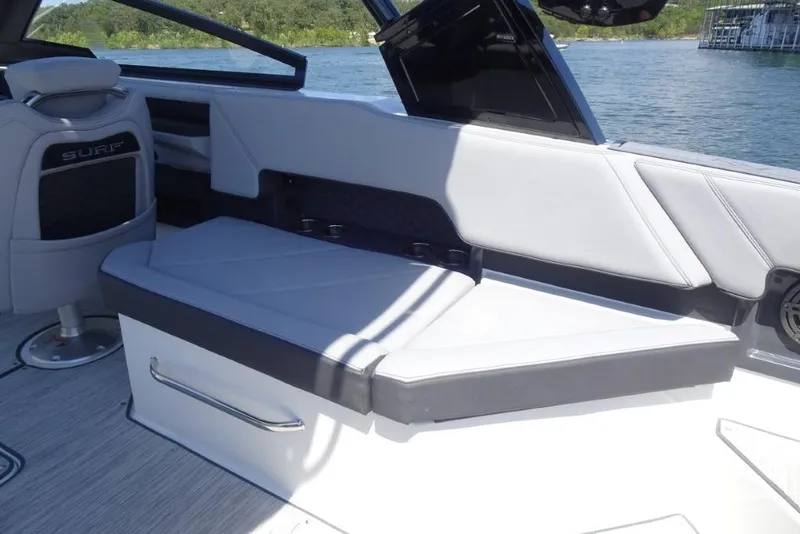 Slide: The Image of 2026 Cobalt R8 Surf boat interior with sleek seating and modern design. - 9