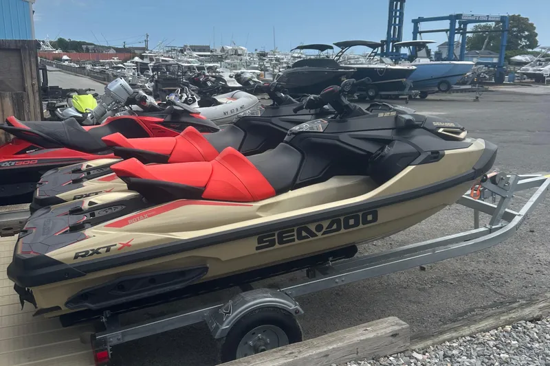 Slide: The Image of 2025 Sea-Doo RXT-X 325 jet ski on trailer at marina. - 6