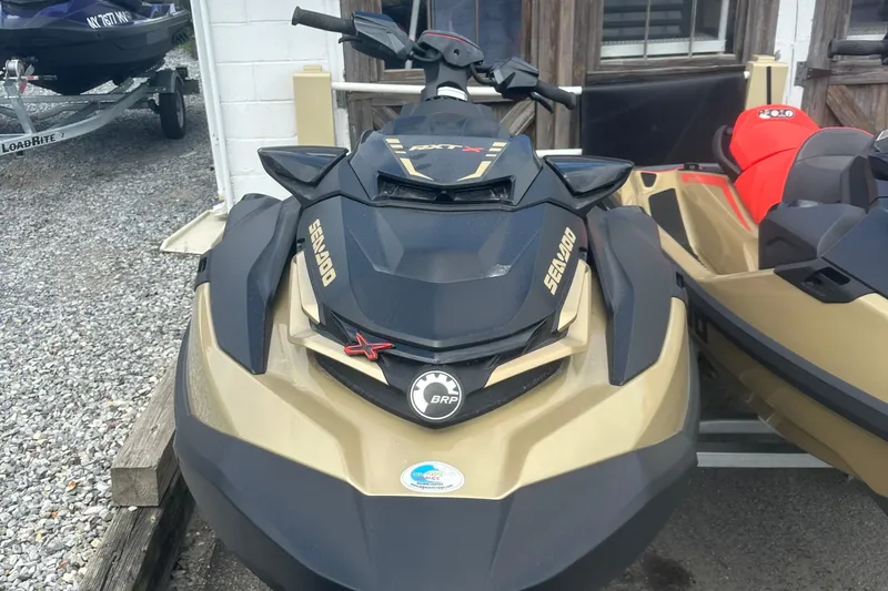 Slide: The Image of 2025 Sea-Doo RXT-X 325 jet ski in a showroom, front view. - 8